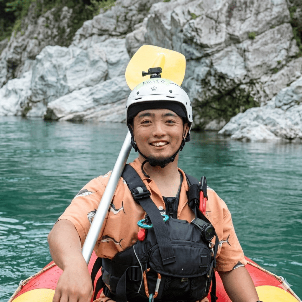 Kaito, river guide at Happy Raft rafting company, in a raft on the Yoshino River in the Oboke gorge, Japan.